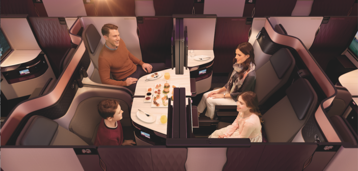 The unique Qsuite business class. Four seats are arranged together, which can be kept separate, or with the simple slide of panels, two, three or all four of the suites can be converted into an open area for a family or other traveling group to dine together. Double beds can also be deployed