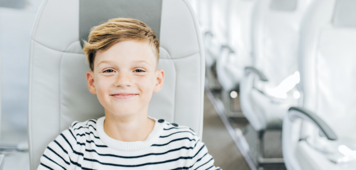 a child flying alone on an airBaltic plane