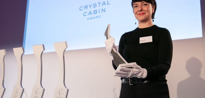 Carmen Krause is project director of the Crystal Cabin Awards holding a trophy