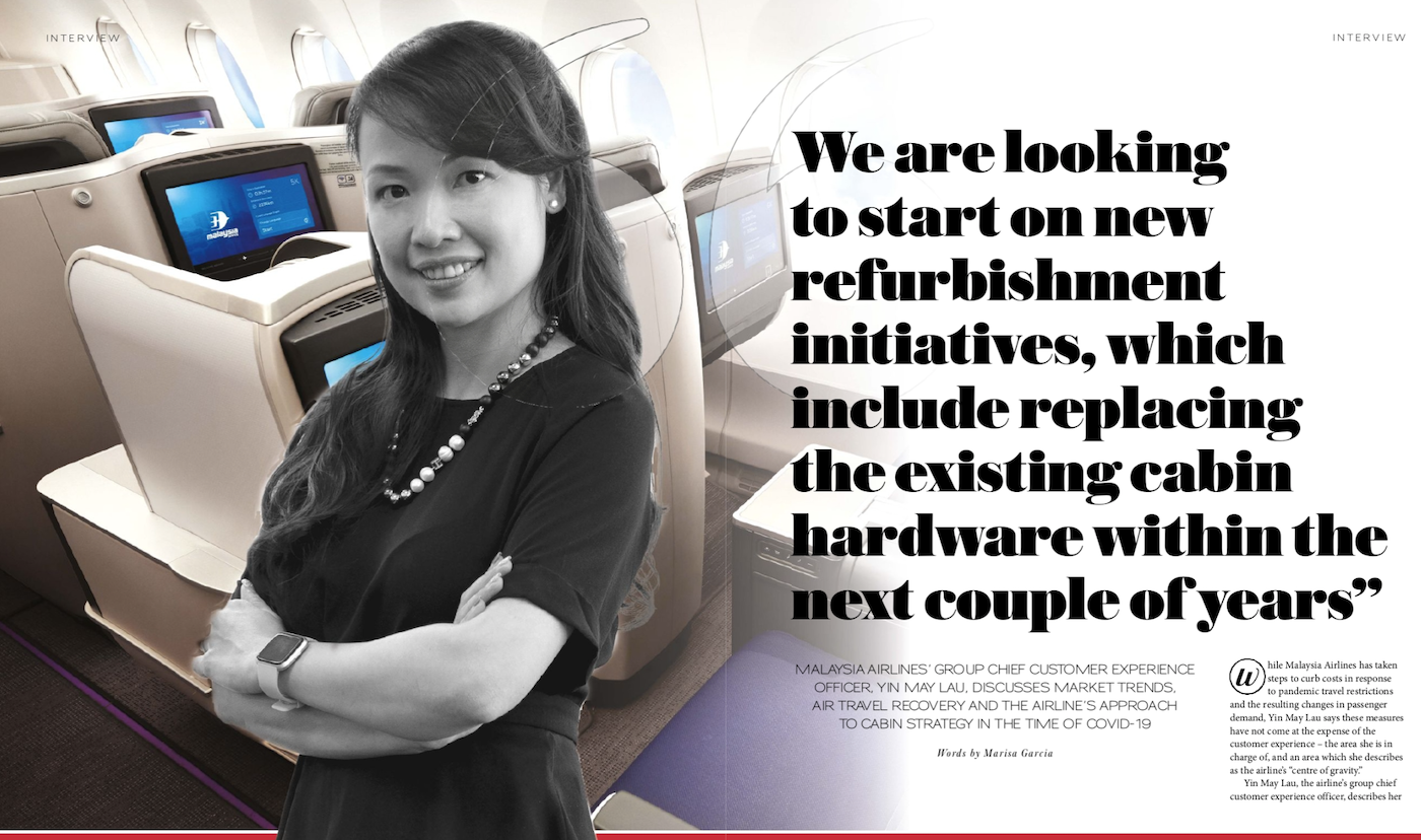 yin may lau standing in an aircraft cabin