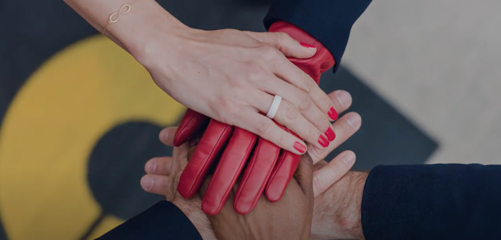 several womens hands together in unity