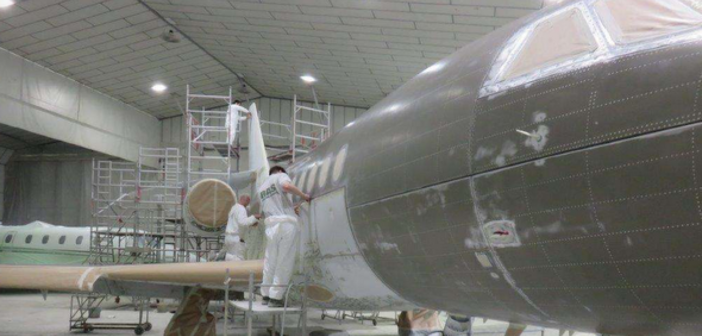 A plane being painted at RAS Group's hangar
