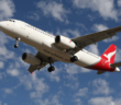 A QantasLink Airbus A320 plane flying in the sky