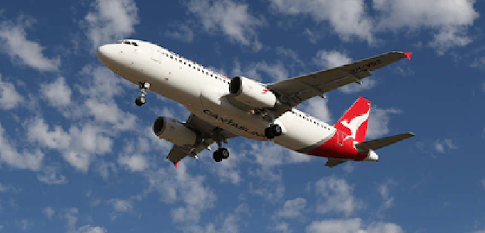 A QantasLink Airbus A320 plane flying in the sky