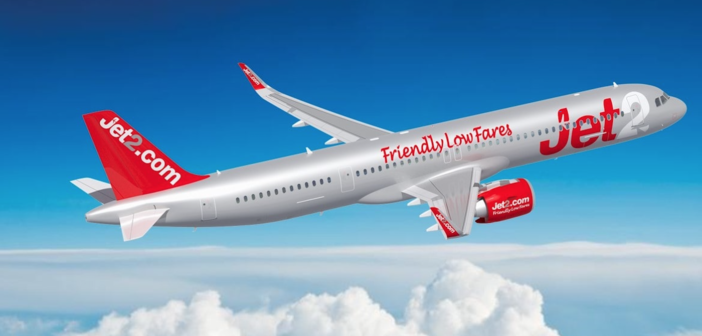 A jet2.com A321neo plane flying across a blue sky