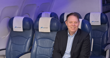 Michael Savidge sitting in an aircraft seat