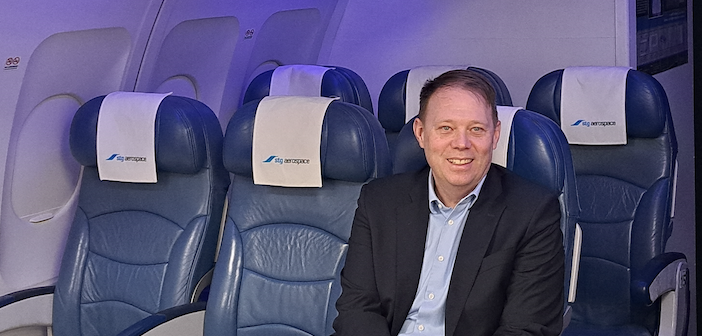 Michael Savidge sitting in an aircraft seat