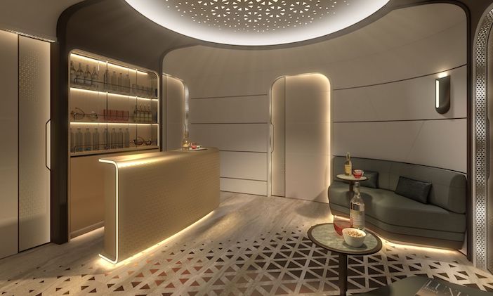 The entry area in Lufthansa Technik's BBJ-9 VIP cabin concept, with a bar and sofa