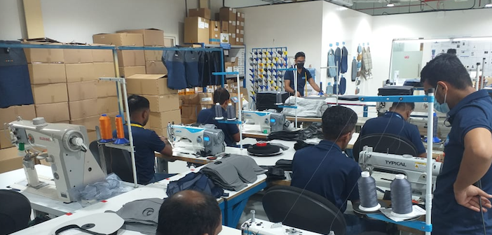 workers stiching seat covers in Soisa's new facility in Dubai