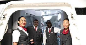 air canada crew welcoming guests at the aircraft door