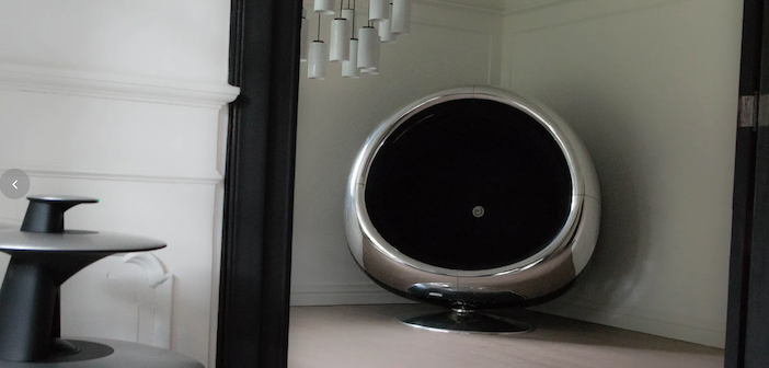 a round chrome chair made from a Boeing 737 engine intake