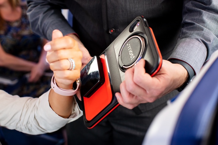 A customer paying on the most.Onthego hardware using their smartwatch