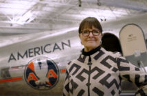 Bonnie Tiburzi Caputo from American Airlines standing in front of a classic airplane