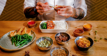 Chef Raul Tronco adding spices to a Cathay Pacific inflight meal