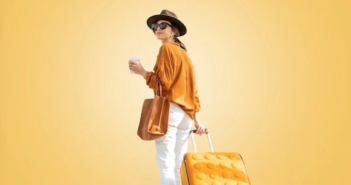 Technology is key to a better passenger experience, says SITA a lady in a yellow and white outfit, with a matching suitcase